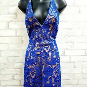 Blue and gold patterned halter dress on a mannequin