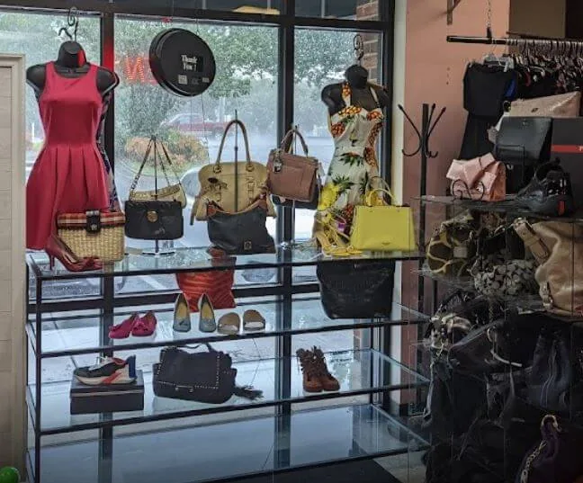 Handbags and dresses displayed by the windows inside Serendipity